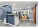 Modern dining area adjacent to the kitchen, featuring sliding doors and a unique barn door at 3048 Cottonwood Se Dr, Atlanta, GA 30316