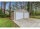 Exterior view of the garage with two large doors on a sunny day at 3048 Cottonwood Se Dr, Atlanta, GA 30316