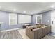Comfortable living room with a large screen, projector, and a neutral-toned sectional sofa at 3048 Cottonwood Se Dr, Atlanta, GA 30316