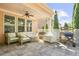 Inviting covered patio with comfortable seating, ceiling fan, and an outdoor grill, ideal for relaxation at 3739 Union Park Dr, Duluth, GA 30097
