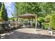 Cozy outdoor patio featuring a gazebo with a dining table set, and a grill, perfect for outdoor entertaining at 3739 Union Park Dr, Duluth, GA 30097