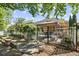 Spacious backyard with a gazebo-covered patio, garden area, and secure fencing, perfect for outdoor enjoyment at 3739 Union Park Dr, Duluth, GA 30097