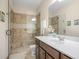 Stylish bathroom featuring a glass shower door and a single sink vanity at 3739 Union Park Dr, Duluth, GA 30097