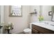 Cozy bathroom with wood vanity, white sink, and decorative accents, perfect for guests at 3739 Union Park Dr, Duluth, GA 30097