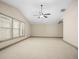 Large bonus room with vaulted ceilings, neutral carpet, and ample light from big windows at 3739 Union Park Dr, Duluth, GA 30097