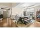 Elegant dining area with stylish table, chandelier, and hardwood floors offers an inviting space for meals at 3739 Union Park Dr, Duluth, GA 30097
