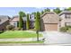 Charming home with manicured lawn, stone accents, and a two-car garage on a sunny day at 3739 Union Park Dr, Duluth, GA 30097