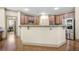 Open kitchen with stainless steel appliances and lots of cabinets, plus breakfast bar for extra seating at 3739 Union Park Dr, Duluth, GA 30097