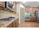 Gourmet kitchen features granite countertops, stainless steel appliances, and ample cabinet space at 3739 Union Park Dr, Duluth, GA 30097