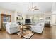 Bright living room with hardwood floors, fireplace, and cozy seating provides a comfortable gathering space at 3739 Union Park Dr, Duluth, GA 30097