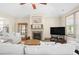 Inviting living room features a cozy fireplace, ceiling fan, and plenty of comfortable seating at 3739 Union Park Dr, Duluth, GA 30097