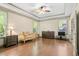 Spacious main bedroom features tray ceilings, hardwood floors, and large windows for natural light at 3739 Union Park Dr, Duluth, GA 30097