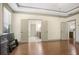 Spacious main bedroom with hardwood floors and doors to the bathroom with generous natural light at 3739 Union Park Dr, Duluth, GA 30097