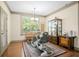 Bright office with hardwood floors, cabinet storage, exercise equipment and large window with greenery at 3739 Union Park Dr, Duluth, GA 30097