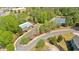 Aerial view showing community amenities with pool and tennis courts nestled among lush trees at 541 Lombard St, Marietta, GA 30064
