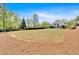 Expansive backyard with lush green lawn and well-maintained landscaping, perfect for outdoor activities at 541 Lombard St, Marietta, GA 30064