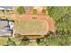 Expansive backyard with a lush lawn, a patio with outdoor furniture, and privacy provided by a wooden fence and mature trees at 541 Lombard St, Marietta, GA 30064