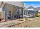 Well-maintained backyard with a screened porch, patio, and lush lawn extending to the treeline at 541 Lombard St, Marietta, GA 30064