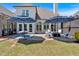 Spacious backyard with a patio featuring seating and dining areas, with views of the home's rear exterior at 541 Lombard St, Marietta, GA 30064