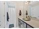 Modern bathroom with a unique vessel sink, dark wood cabinets and a shower in the next room at 541 Lombard St, Marietta, GA 30064