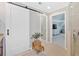 Modern bathroom hallway featuring a barn door and access to the en suite bath at 541 Lombard St, Marietta, GA 30064