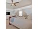 Cozy bedroom featuring a tray ceiling, carpet flooring, and a sitting area in the background at 541 Lombard St, Marietta, GA 30064