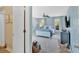 Stylish bedroom with blue accents, including a basket of blankets and a wooden duck at 541 Lombard St, Marietta, GA 30064