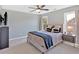 Cozy bedroom with a comfortable bed, neutral tones, and ample natural light from the windows at 541 Lombard St, Marietta, GA 30064