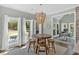 Charming breakfast nook with a round table, bar stools, and scenic backyard views at 541 Lombard St, Marietta, GA 30064