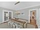 Bright dining room featuring a wooden table, white chairs, and modern light fixture at 541 Lombard St, Marietta, GA 30064
