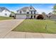 Beautiful two-story home featuring a three-car garage, welcoming porch, and meticulously maintained lawn at 541 Lombard St, Marietta, GA 30064