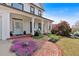 Inviting front porch with brick walkway, colorful flowers, and Adirondack chairs for relaxing at 541 Lombard St, Marietta, GA 30064