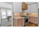 Well-equipped kitchen featuring stainless steel appliances and modern cabinetry adjacent to the dining area at 541 Lombard St, Marietta, GA 30064