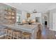 Contemporary kitchen with a center island, barstool seating, and modern brick wall accents at 541 Lombard St, Marietta, GA 30064