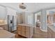 Spacious kitchen with a center island and stainless steel refrigerator at 541 Lombard St, Marietta, GA 30064