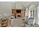 Inviting living room featuring a stone fireplace, built-in shelves, and plenty of seating at 541 Lombard St, Marietta, GA 30064