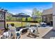 Inviting patio area with comfortable seating, fire pit, umbrellas, and lush green lawn at 541 Lombard St, Marietta, GA 30064