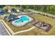 Aerial view of a community pool and playground for the community at 802 Milo Bay St, Loganville, GA 30052
