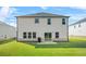 Large backyard featuring a grill, patio and a lush green lawn at 802 Milo Bay St, Loganville, GA 30052