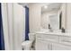 Neat bathroom featuring a large mirror and a shower with modern fixtures at 802 Milo Bay St, Loganville, GA 30052
