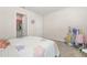 Bedroom with flower-patterned bedspread, plush carpeting, and closet in view at 802 Milo Bay St, Loganville, GA 30052