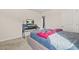 Cozy bedroom featuring neutral tones, a desk and a television at 802 Milo Bay St, Loganville, GA 30052