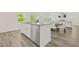 Kitchen island featuring stainless steel dishwasher and cabinets offering ample space and convenience at 802 Milo Bay St, Loganville, GA 30052