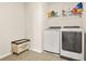 Efficient laundry room with modern appliances and built-in storage at 802 Milo Bay St, Loganville, GA 30052
