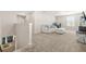 Bright, open loft space with plush carpeting, comfortable seating, and a cozy atmosphere at 802 Milo Bay St, Loganville, GA 30052