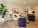 Cozy living room showcasing a modern couch, stylish art, and hardwood floors at 2674 Ne Almand Ne Ln, Conyers, GA 30013