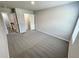 Cozy bedroom features neutral carpeting, a closet, and a bright window at 1351 E Atlanta E Rd, Stockbridge, GA 30281