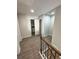 A bright hallway featuring hardwood floors and access to additional rooms in the house at 1351 E Atlanta E Rd, Stockbridge, GA 30281