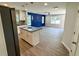 Gourmet kitchen featuring a granite island, stainless appliances, and open view to living area at 1351 E Atlanta E Rd, Stockbridge, GA 30281