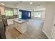 Modern kitchen with granite island, stainless steel appliances, opens up to the living room at 1351 E Atlanta E Rd, Stockbridge, GA 30281